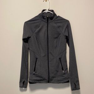 NWOT athletic shape wear jacket with zipper pockets and thumb holes